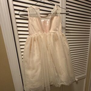 Gorgeous pink dress with pearl accents. Great for any event.